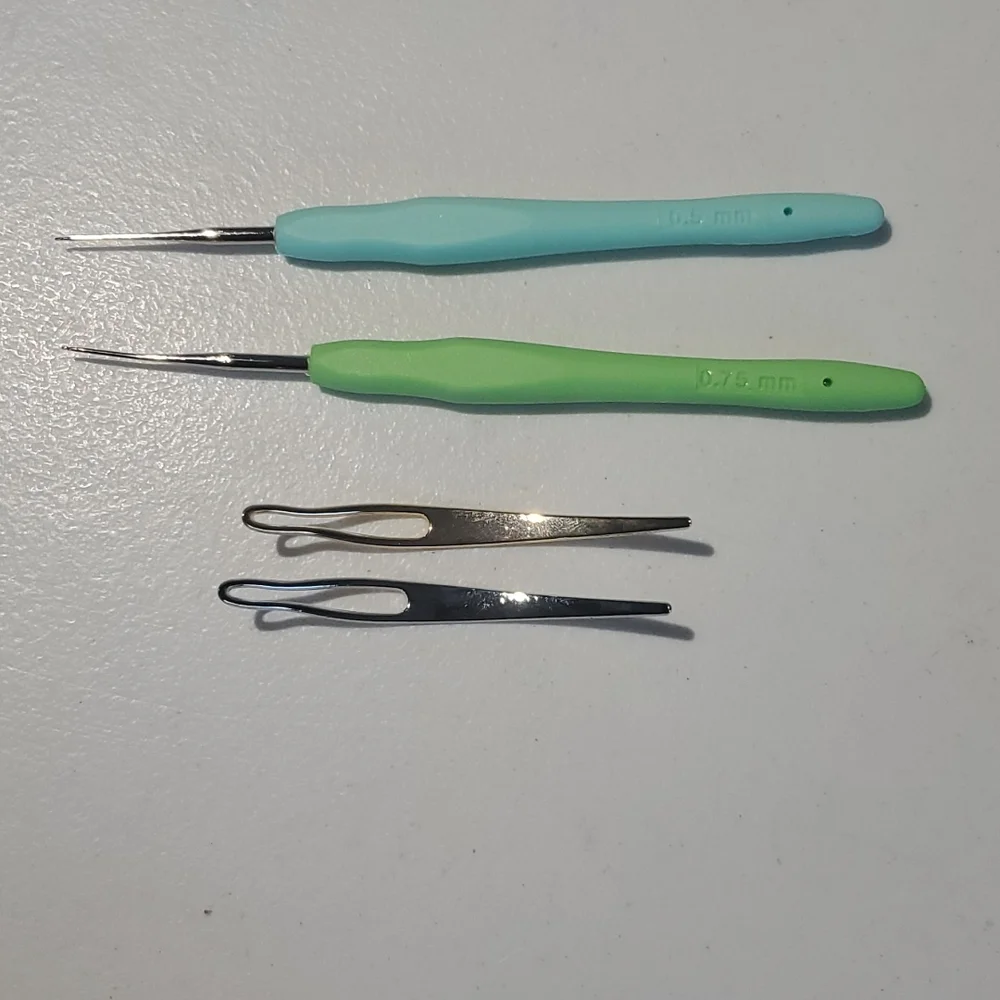 Wig caps (3) and weaving tools